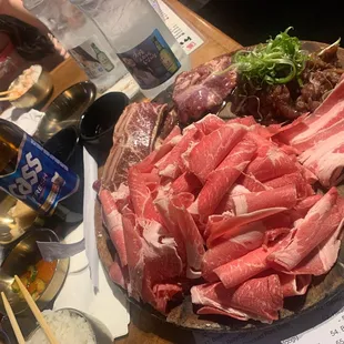 a platter of meat and vegetables
