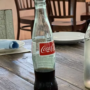 a coke bottle on a table