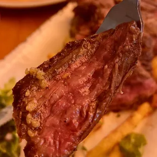 a piece of steak on a fork