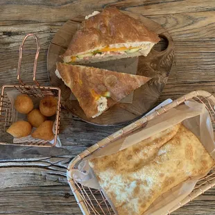 From top, clockwise: Tuna melt, Pastel with chicken + catupiry, Coxinha