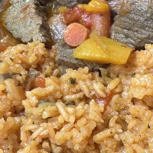 Carne Guisada with arroz con gandules  Beef stew with yellow rice and pigeon peas