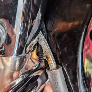 Exposed and fraying clutch cable