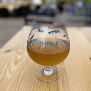 a glass of beer on a table