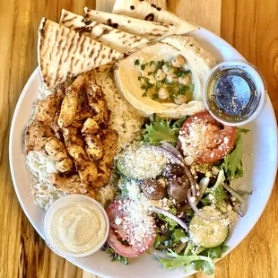 a plate of food on a wooden table