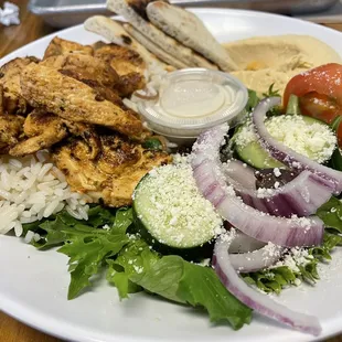 Chicken platter with hummus and Greek salad