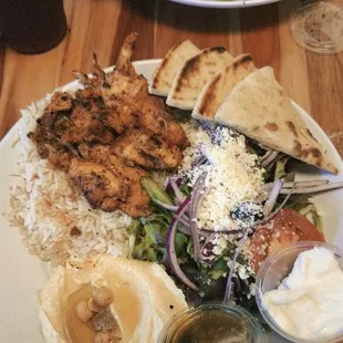 Chicken shawarma plate with humus and Greek salad