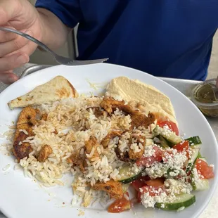 Chicken Shawarma with rice, hummus, and cucumber, tomato salad