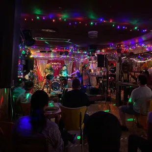 a group of people sitting at a bar