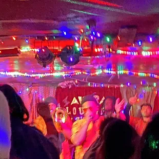a group of people dancing at a party