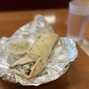Falafel Sandwich w/ side of Hummus.  Soft, fluffy pita. Crispy, crunchy falafel. With tahini and pickles.  The perfect lunch.