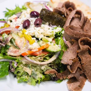 a plate of food with meat and vegetables