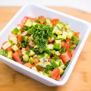 a salad in a white bowl