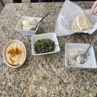Tabouli, hummus, tzatziki and potato salad