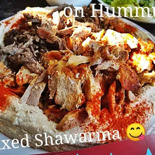 Chicken n Beef Shawarma  WOWED cut off the Spit on a bed of Hummus