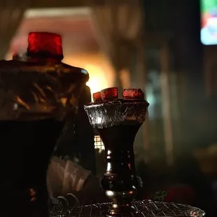 a glass of water and a lit candle