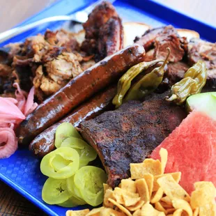 a platter of meat and vegetables