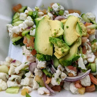 a salad in a styrofoam container