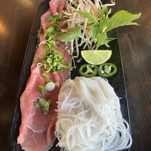 The garnish and meat for the pho