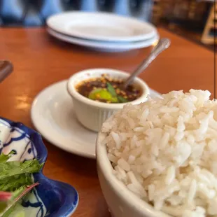 a bowl of rice and a bowl of salad