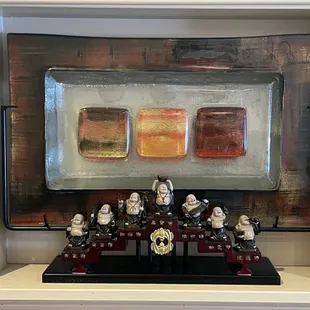 a group of figurines on a shelf