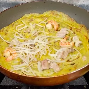 This is what bánh xèo should look like. Pork, shrimp  onions  and bean sprouts