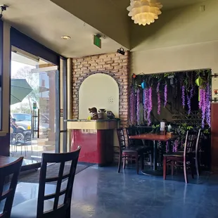 the inside of a restaurant with tables and chairs