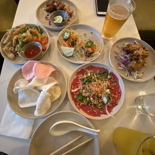 Happy hour. Calamari, shrimp chips, banh mi tacos, quail, bo tai chinh, and fish sauce wings.
