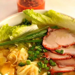 a bowl of soup with meat and vegetables