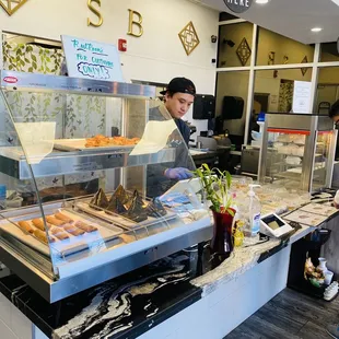 a woman behind the counter