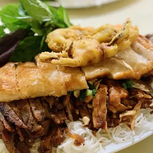 a plate of rice with meat and vegetables