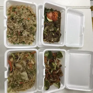 four take out containers of food