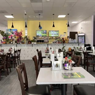 a restaurant with tables and chairs