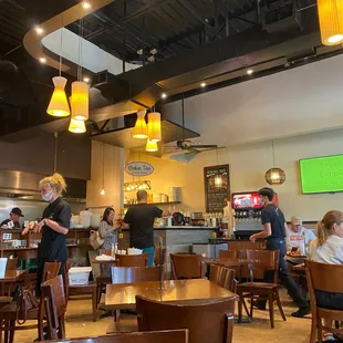 a restaurant with people sitting at tables