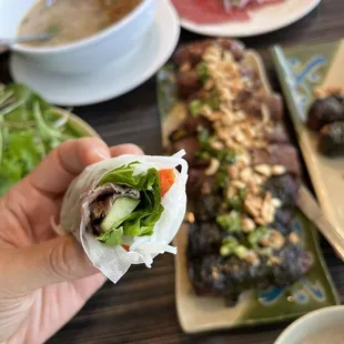 a hand holding a piece of food