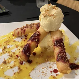 Mango dessert. Fried cheesecake-like filling, with vanilla ice cream and mango puree