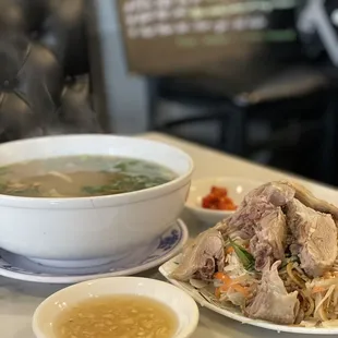 Rice noodle soup with side of duck salad