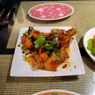 Chicken wings and Imperial rolls. A8 and A1