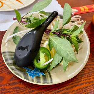 a plate of noodles and vegetables