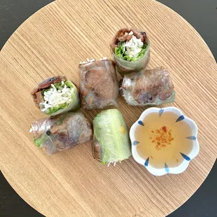 Grilled pork spring roll. Comes with 2 big rolls. Picture of takeout order placed on my own plate and cut into six pieces.