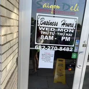 a sign in the window of a business