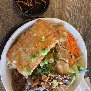 Grill Beef with eggroll and shrimp tofu skin on vermicelli.