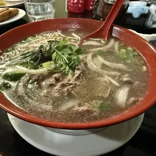 Pho Toi (Beef) rare filet Mignon w/rice noodles soup.