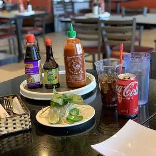 Can of Coke, mint, bean sprouts, hoisin sauce and Sriracha