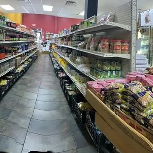 Large collection of sauces, pasted, and dry food.