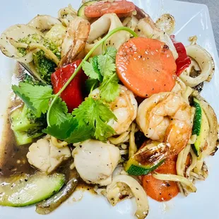 a plate of food with shrimp and vegetables