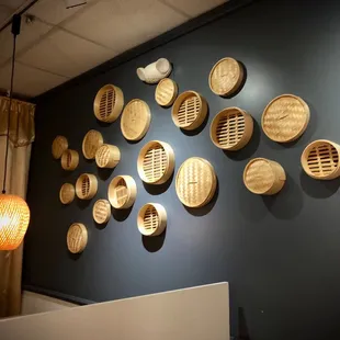 a wall of bamboo baskets