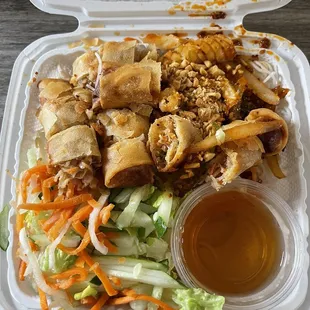 Vermicelli with spring roll and spicy squid