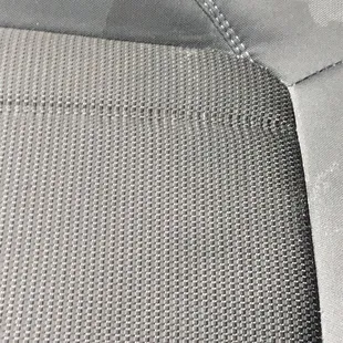 Seat cushion with stains from leaked soup.