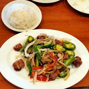 Plate of short ribs, side of steamed rice.