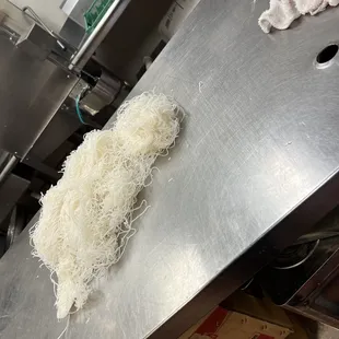 Food on table with dirty clothes